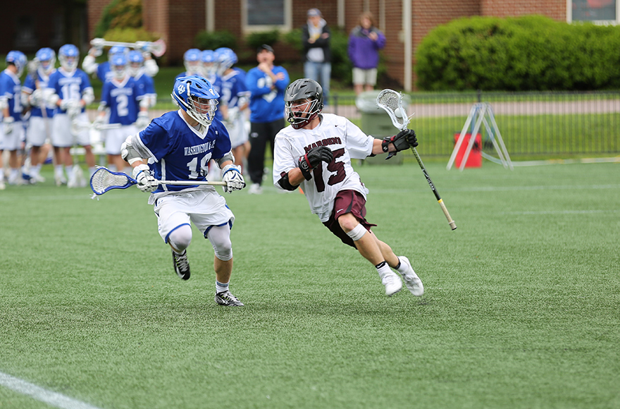 Jackson Scores Game-Winner; 200th Point in 15-14 Win Over W&L