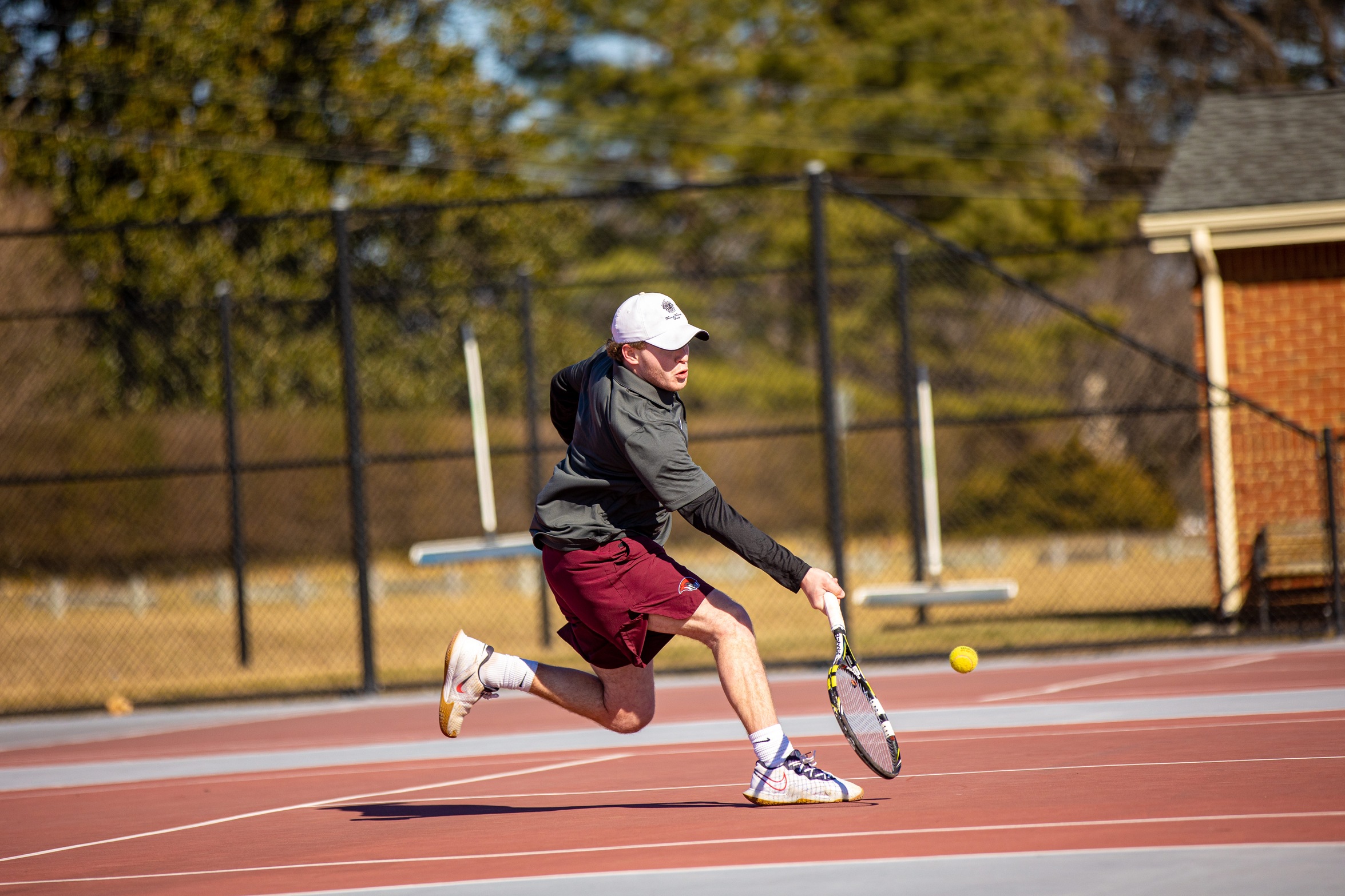 action photo of RC tennis player going to the net