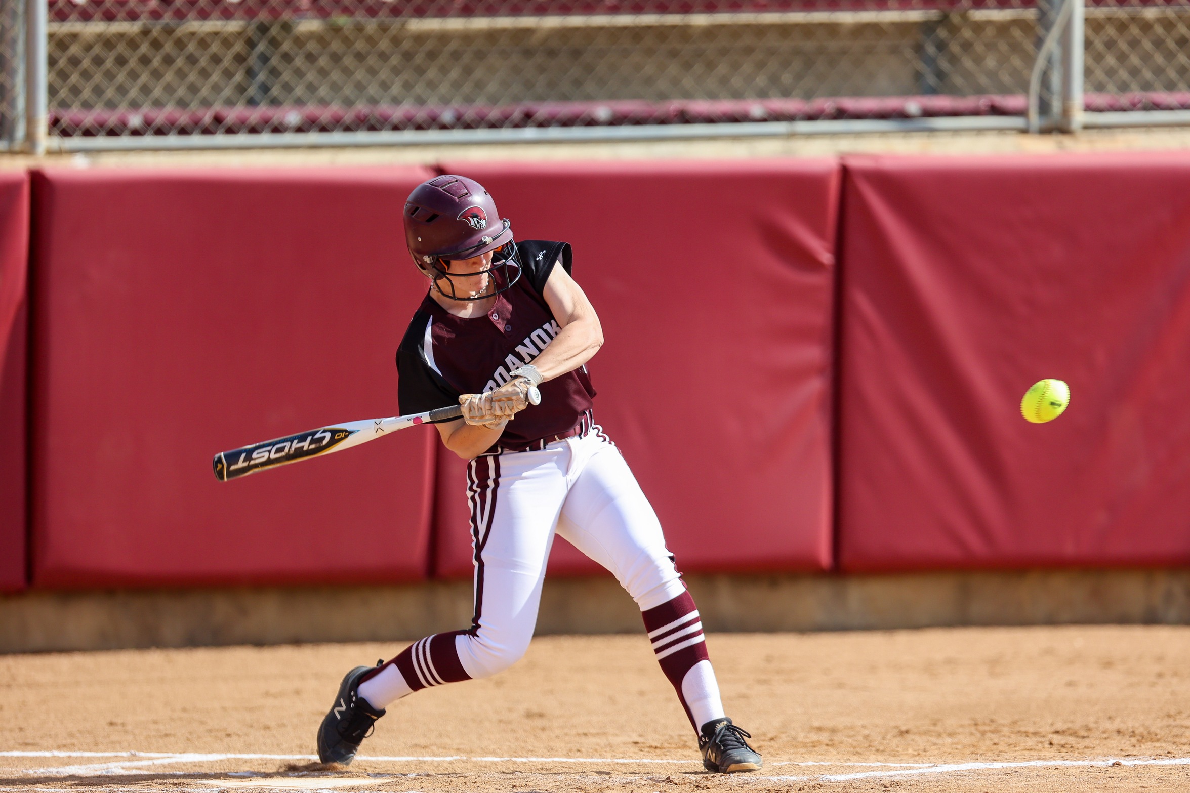 action photo of RC softball hitter Kate Houle