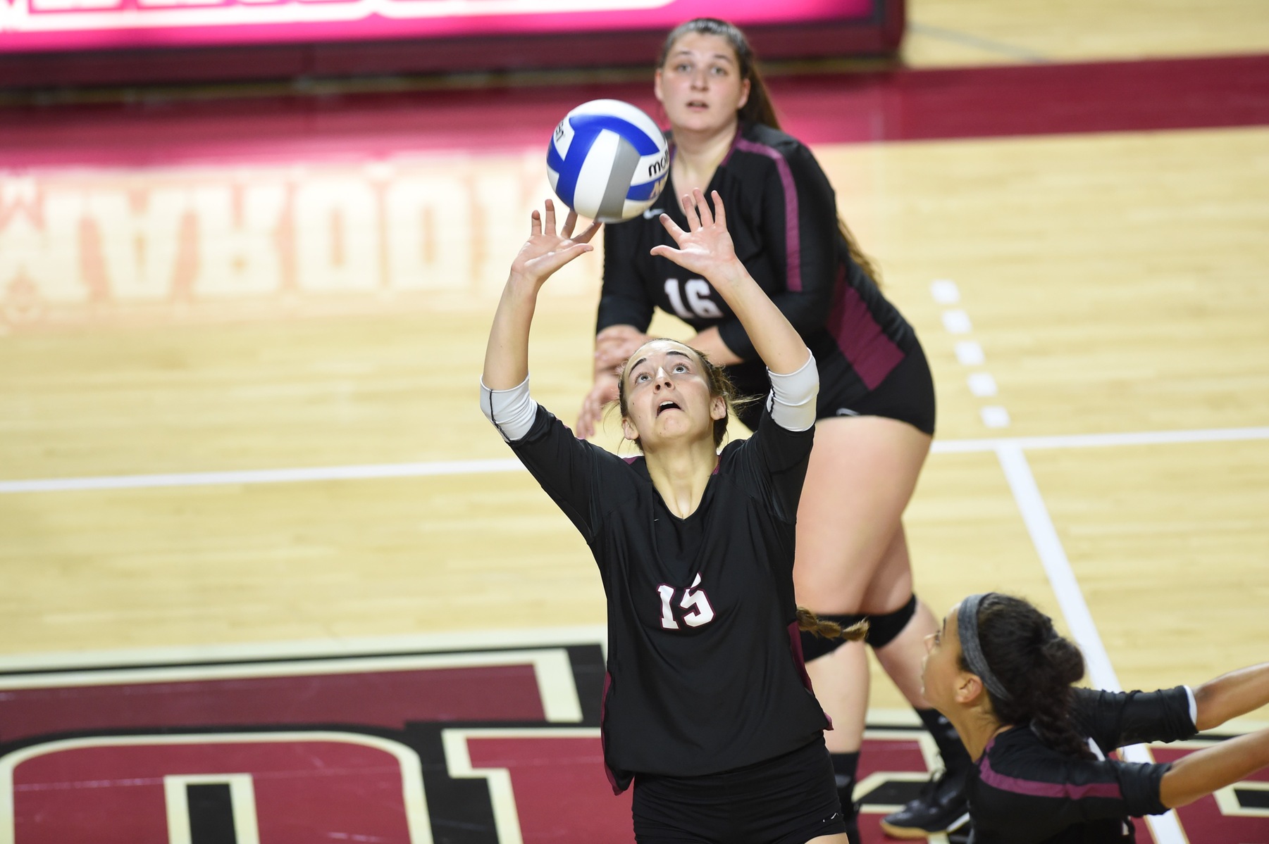 action photo of Roanoke volleyball player Olivia Newman setting the ball
