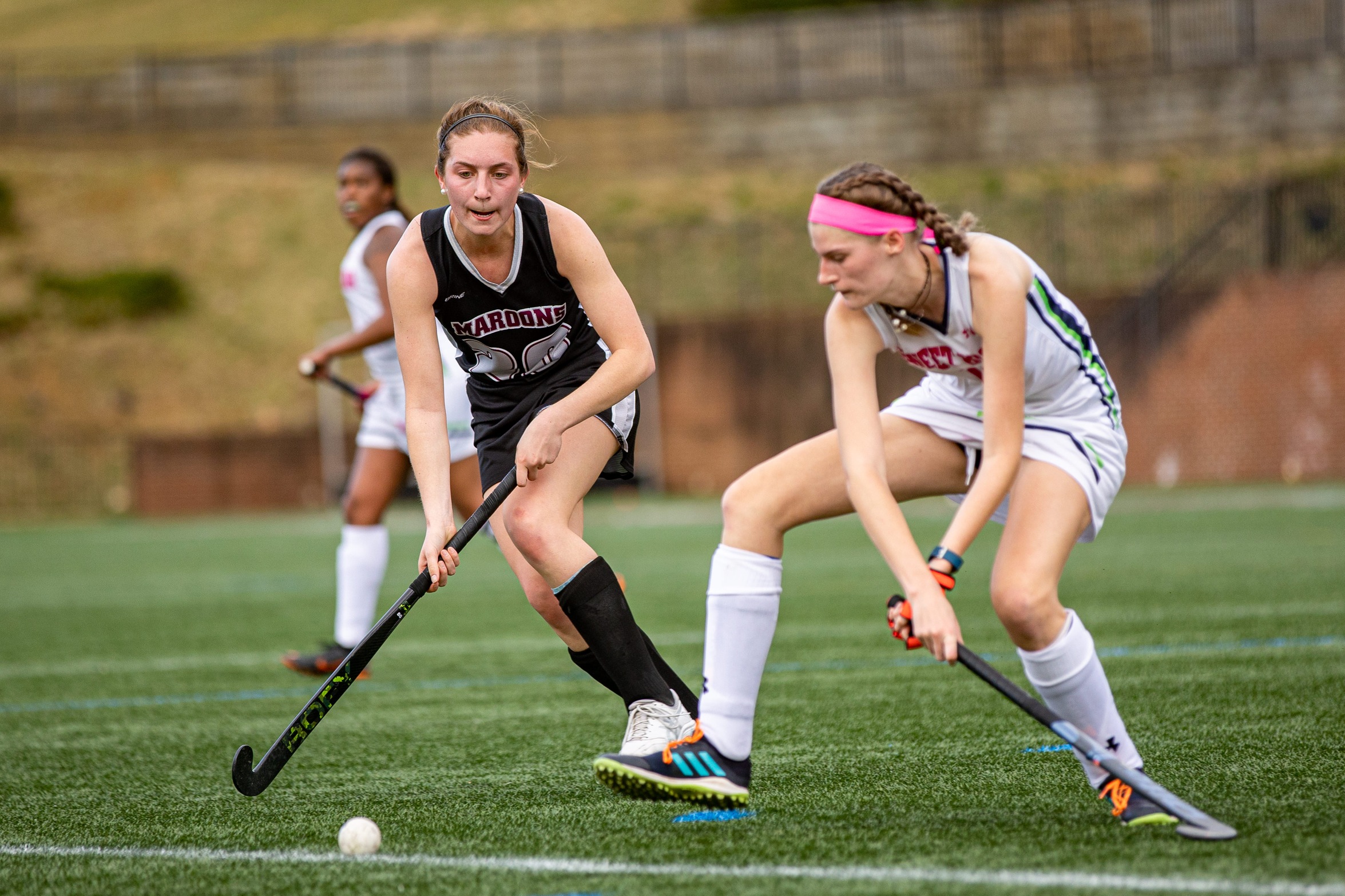 action photo of RC field hockey player Claudia Roncone goin after the ball