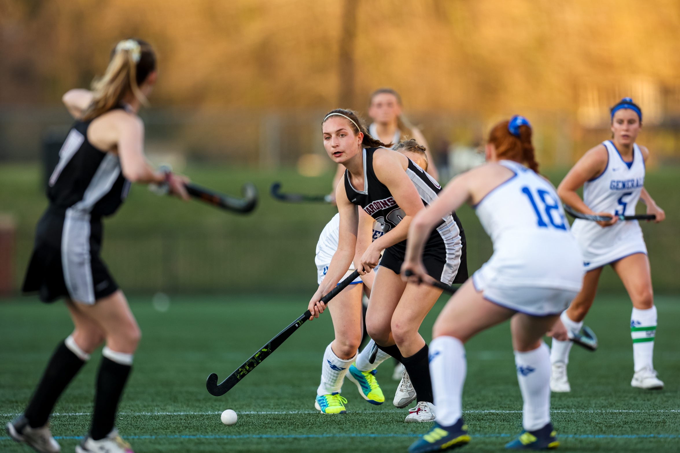 action photo of RC field hockey player Claudia Roncone passing to Emilee Wooten