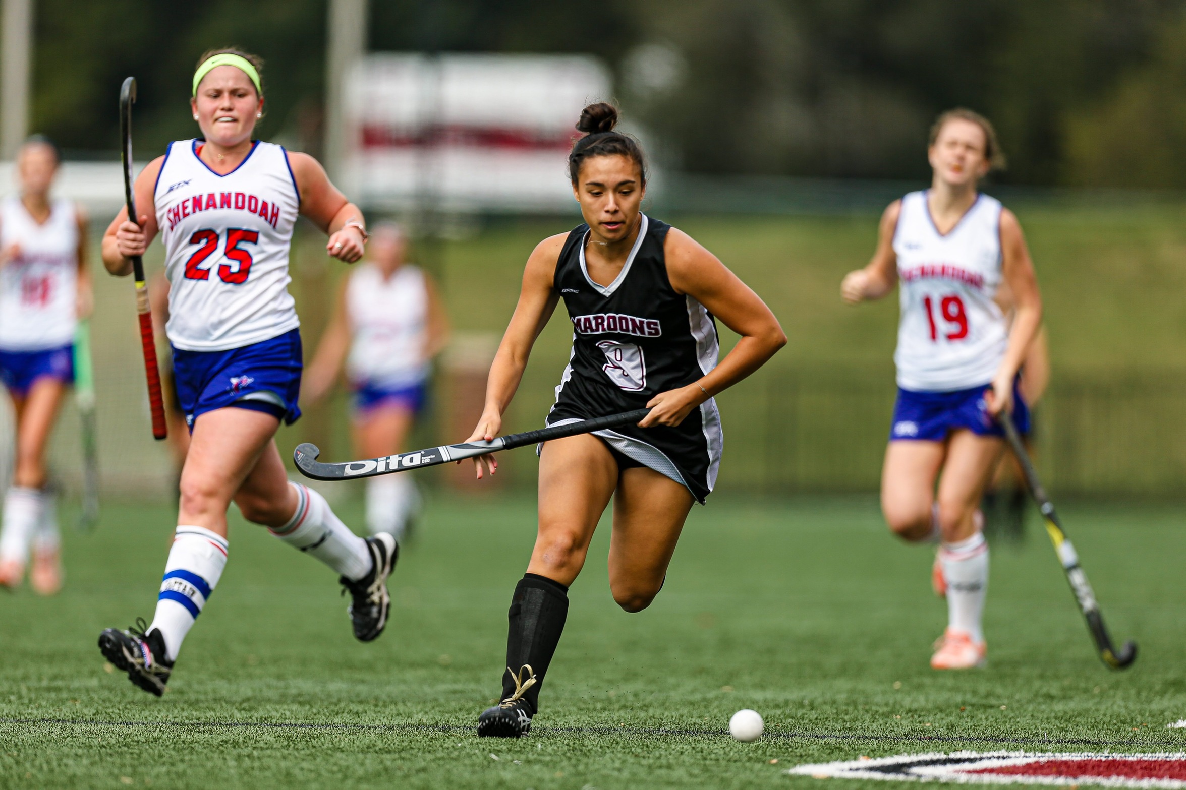 action photo of RC field hockey player Katie Martin