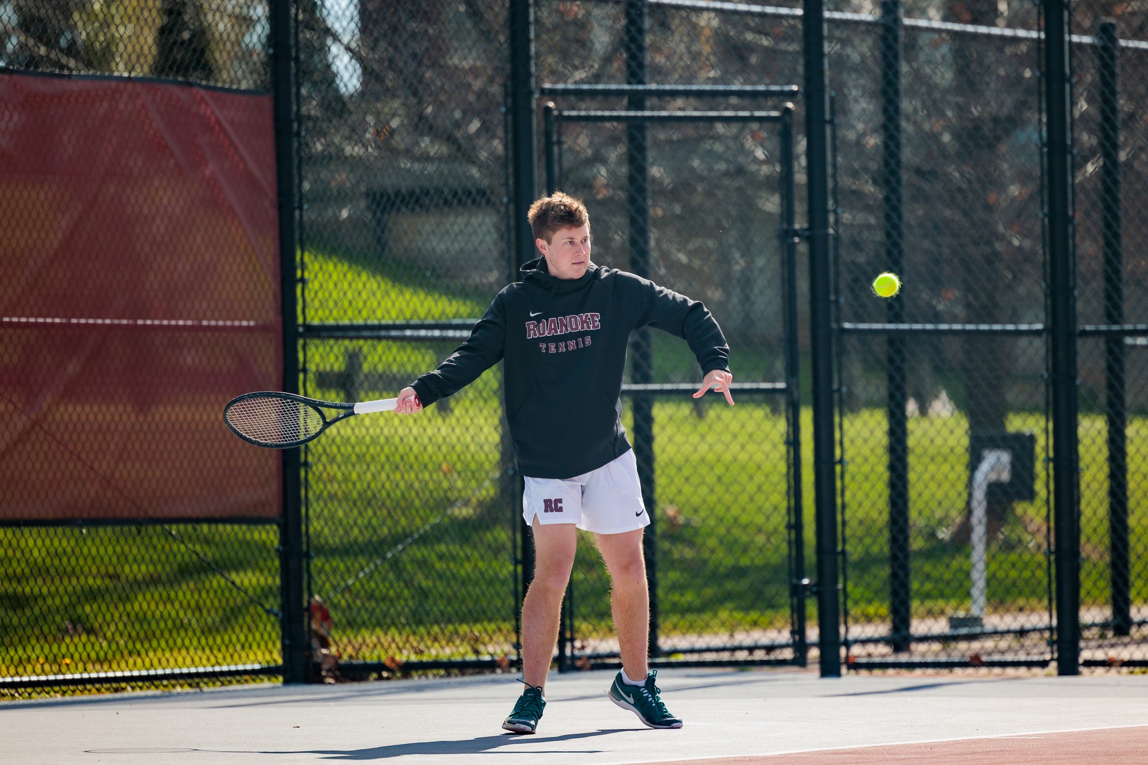 action photo of RC men's tennis player Dalton Capobianco with a forehand
