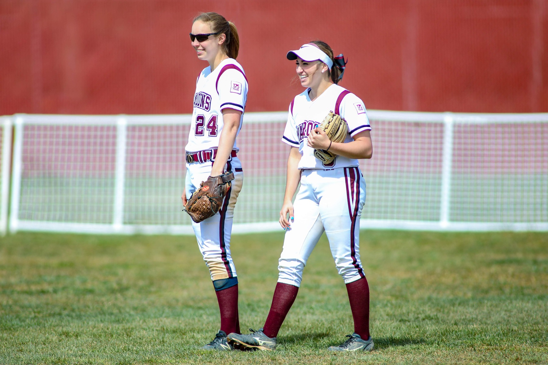 action photo of two RC softball outfielders in between innings.