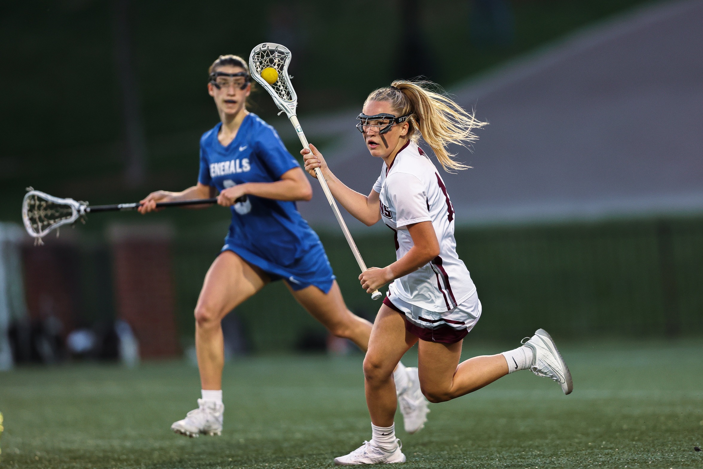 action photo of RC women's lacrosse player