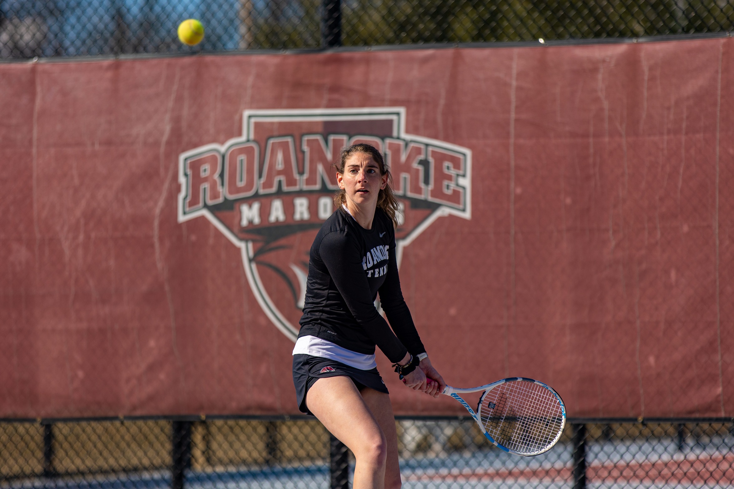 action photo of RC tennis player hitting a backhand