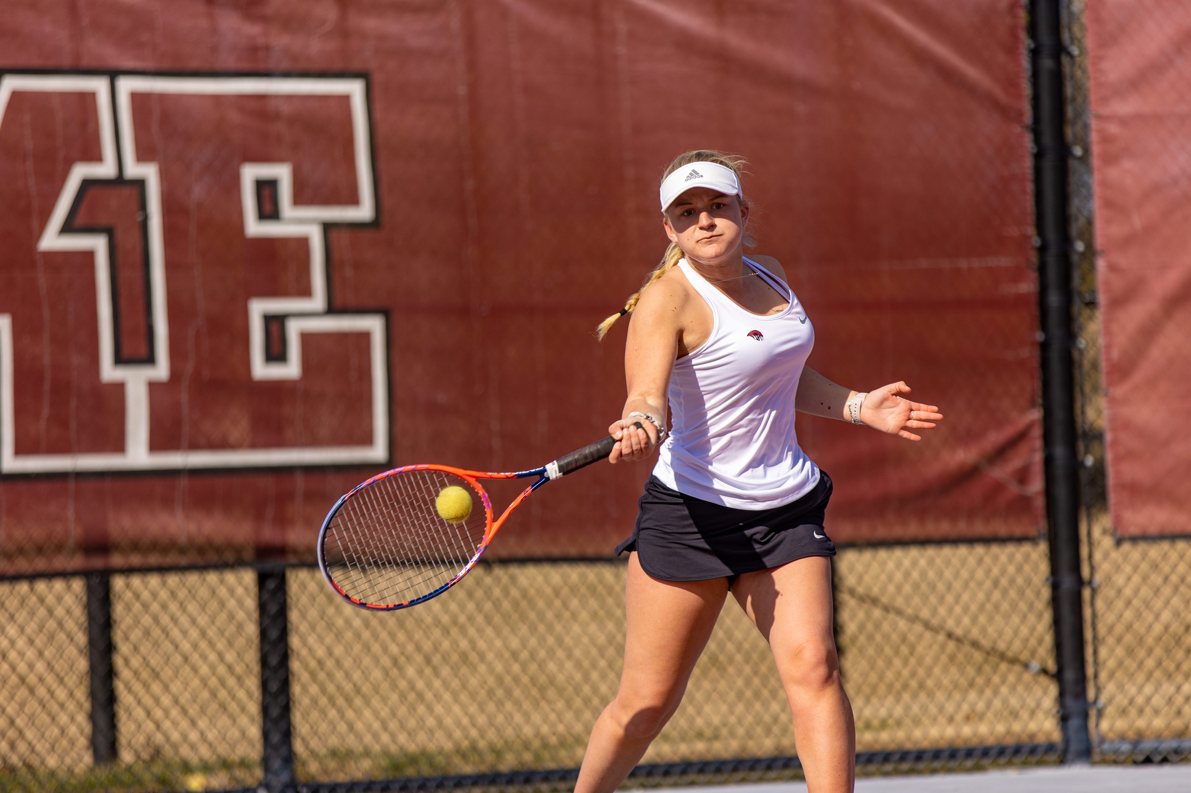 action photo of RC women's tennis player