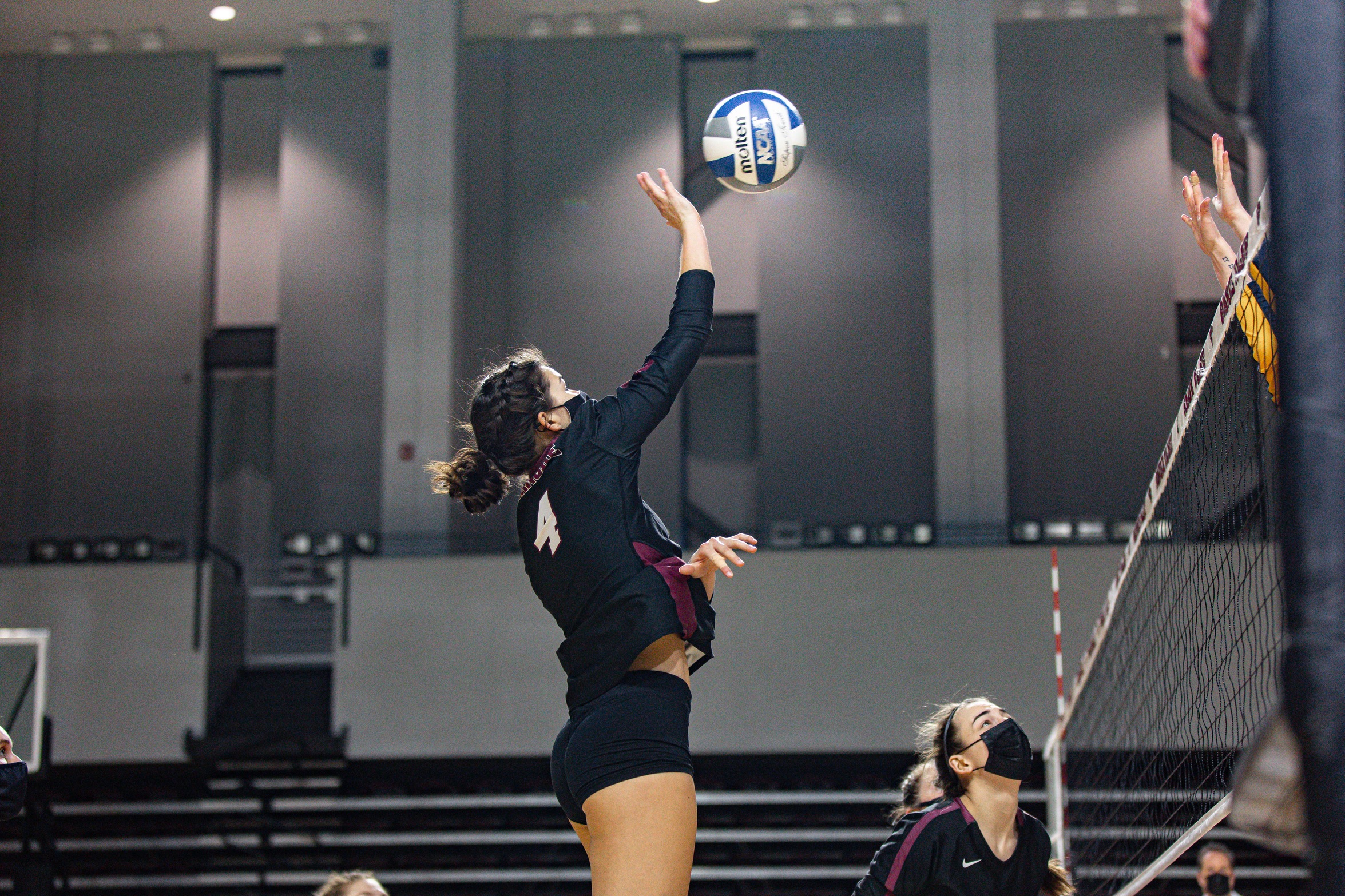 action photo of RC volleyball player Claire Williams with an attack