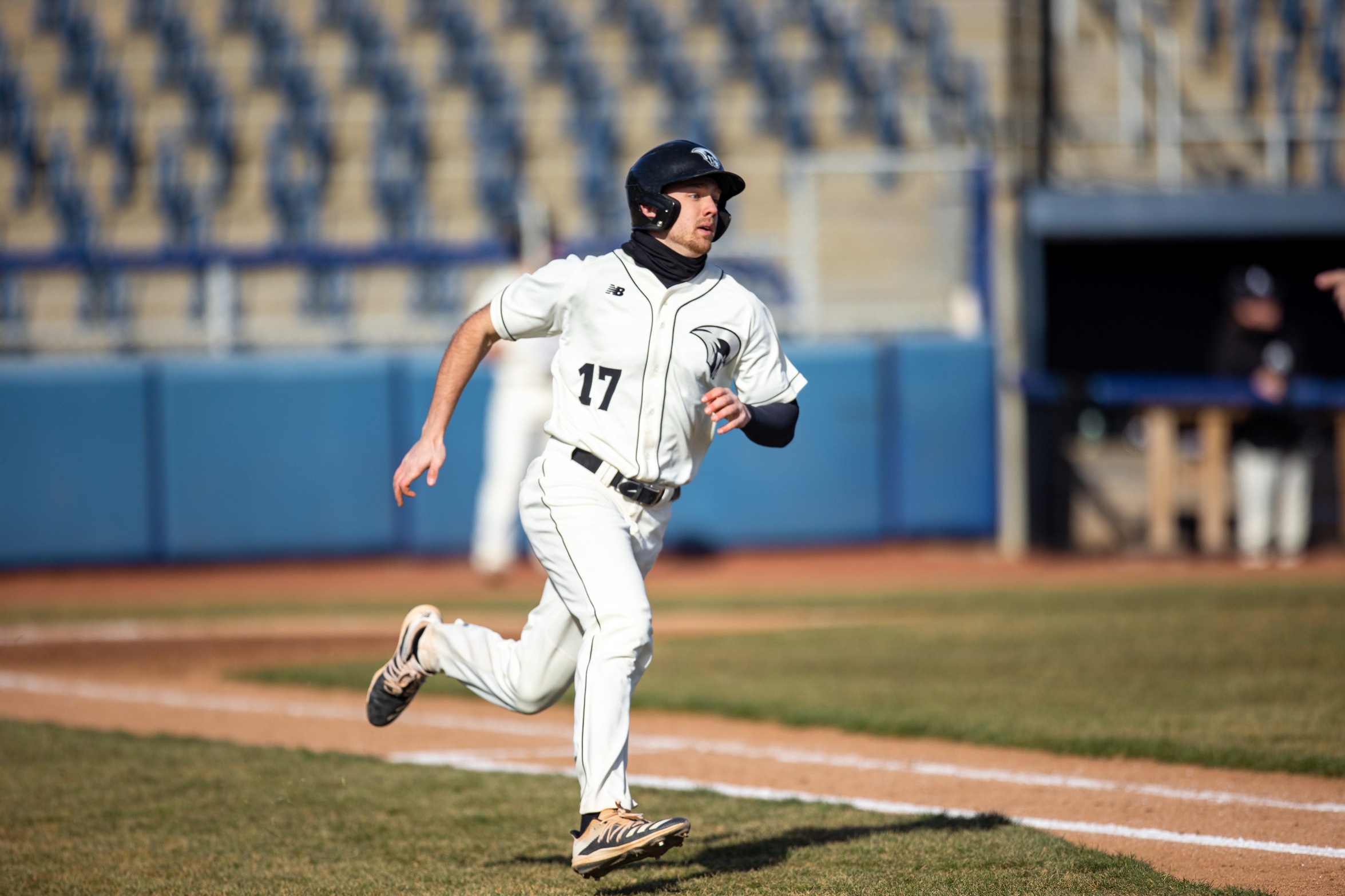 action photo of RC baseball player Will Meriken rounding first