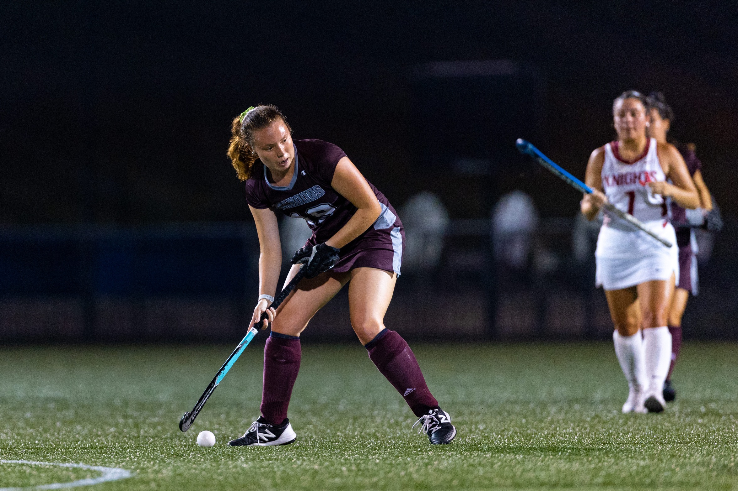 action photo of RC field hockey defender Hope Keller playing a ball