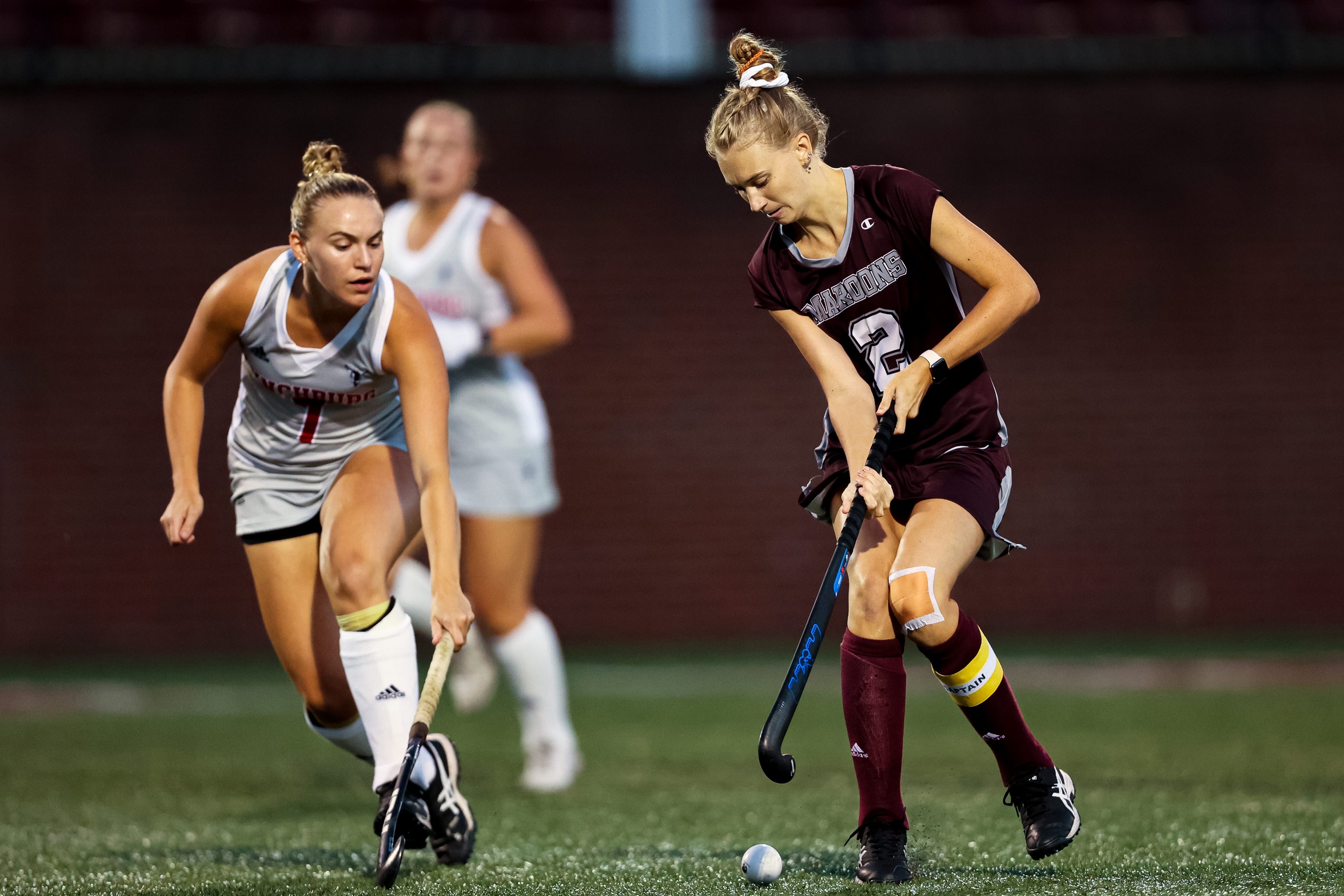 action photo of RC field hockey player Emilee Wooten with the ball on her stick