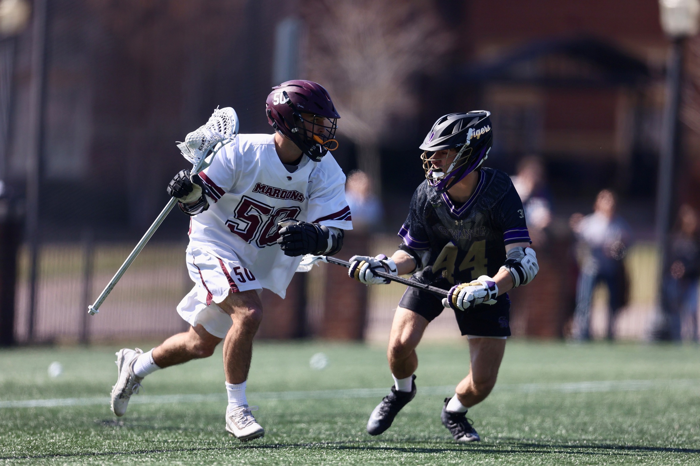 action photo of RC men's lacrosse player Ethan Caldwell