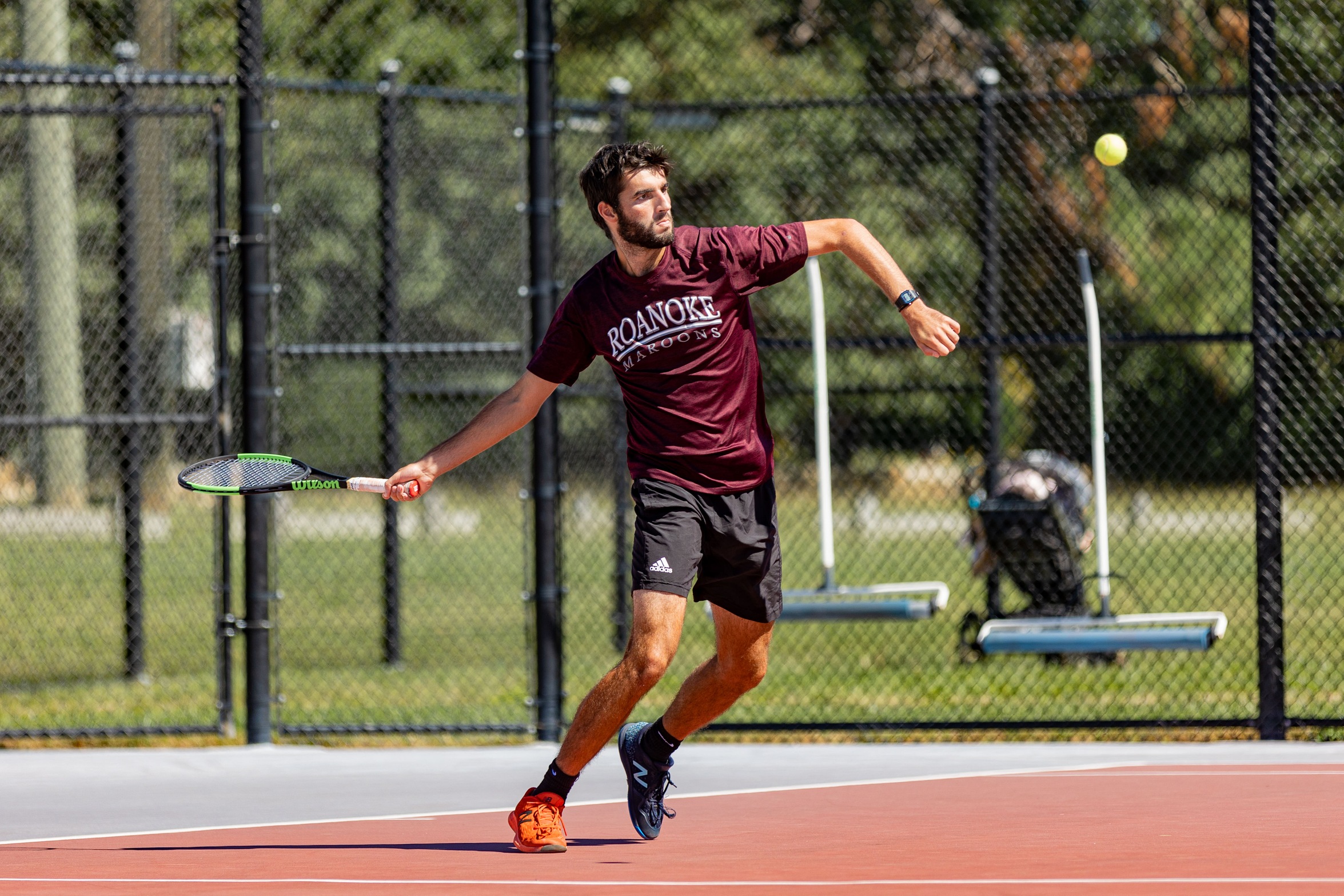 action photo of RC men's tennis player
