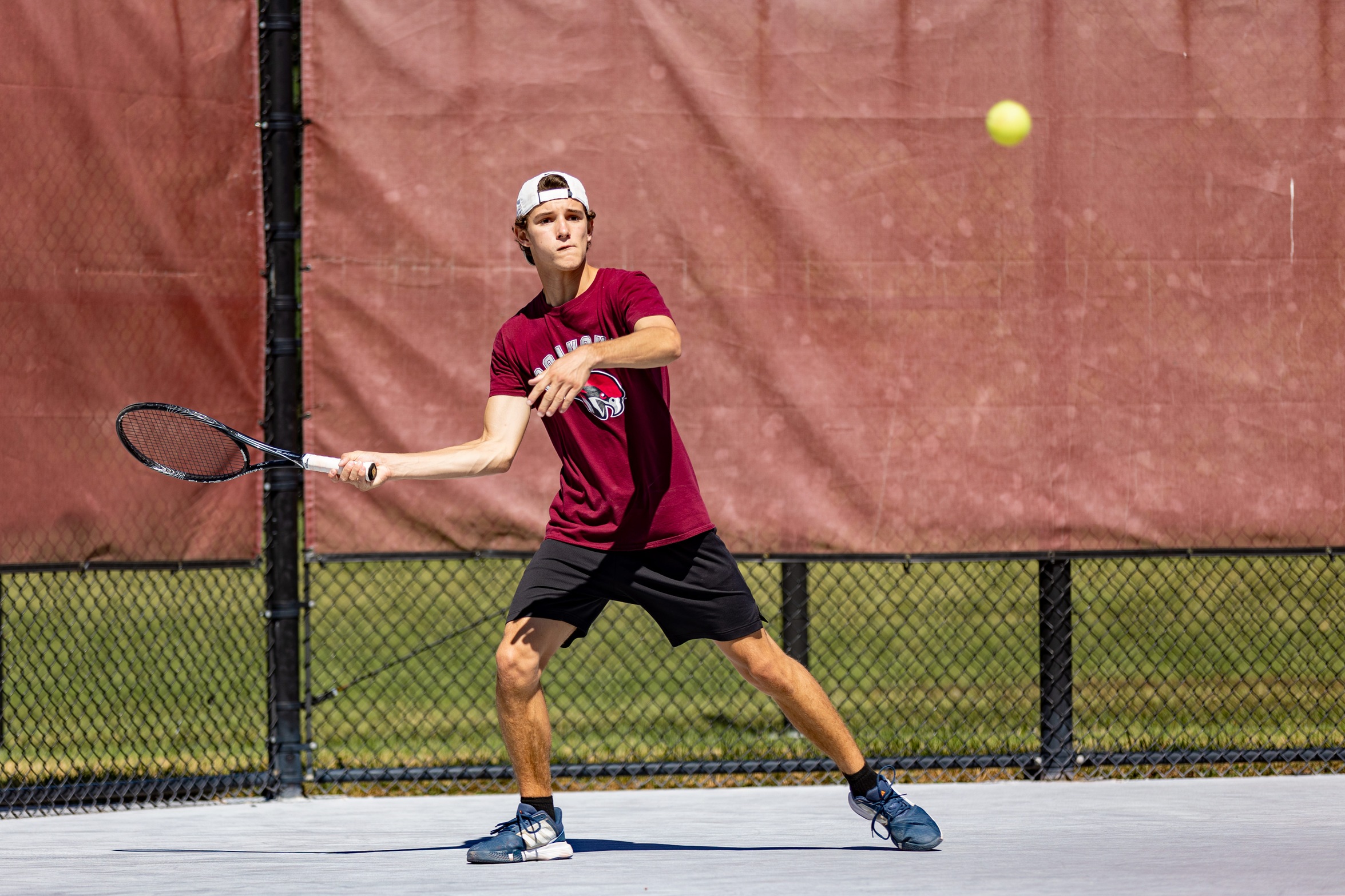 action photo of RC men's tennis player