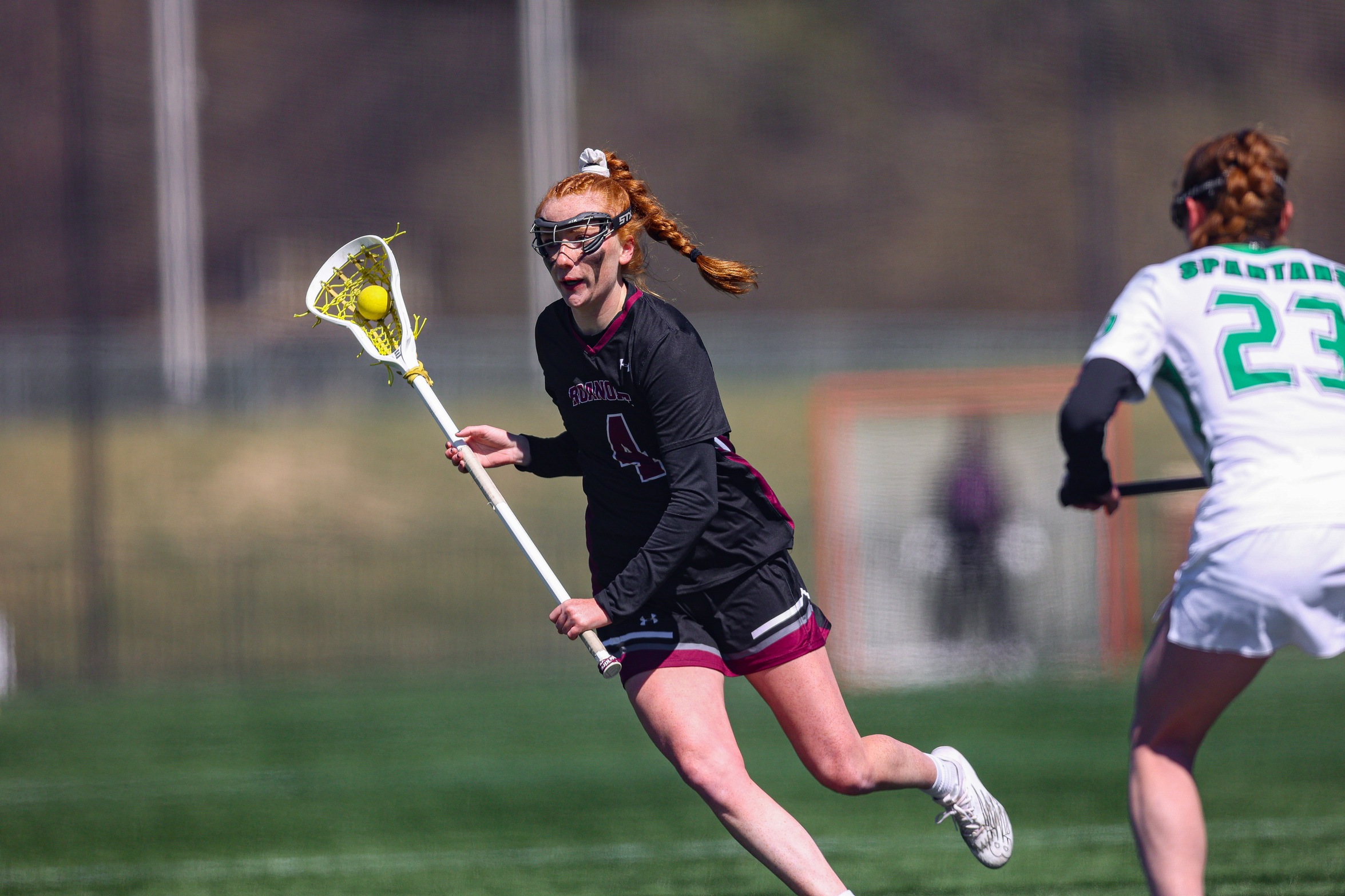 action photo of RC women's lacrosse player Molly Kasemeyer
