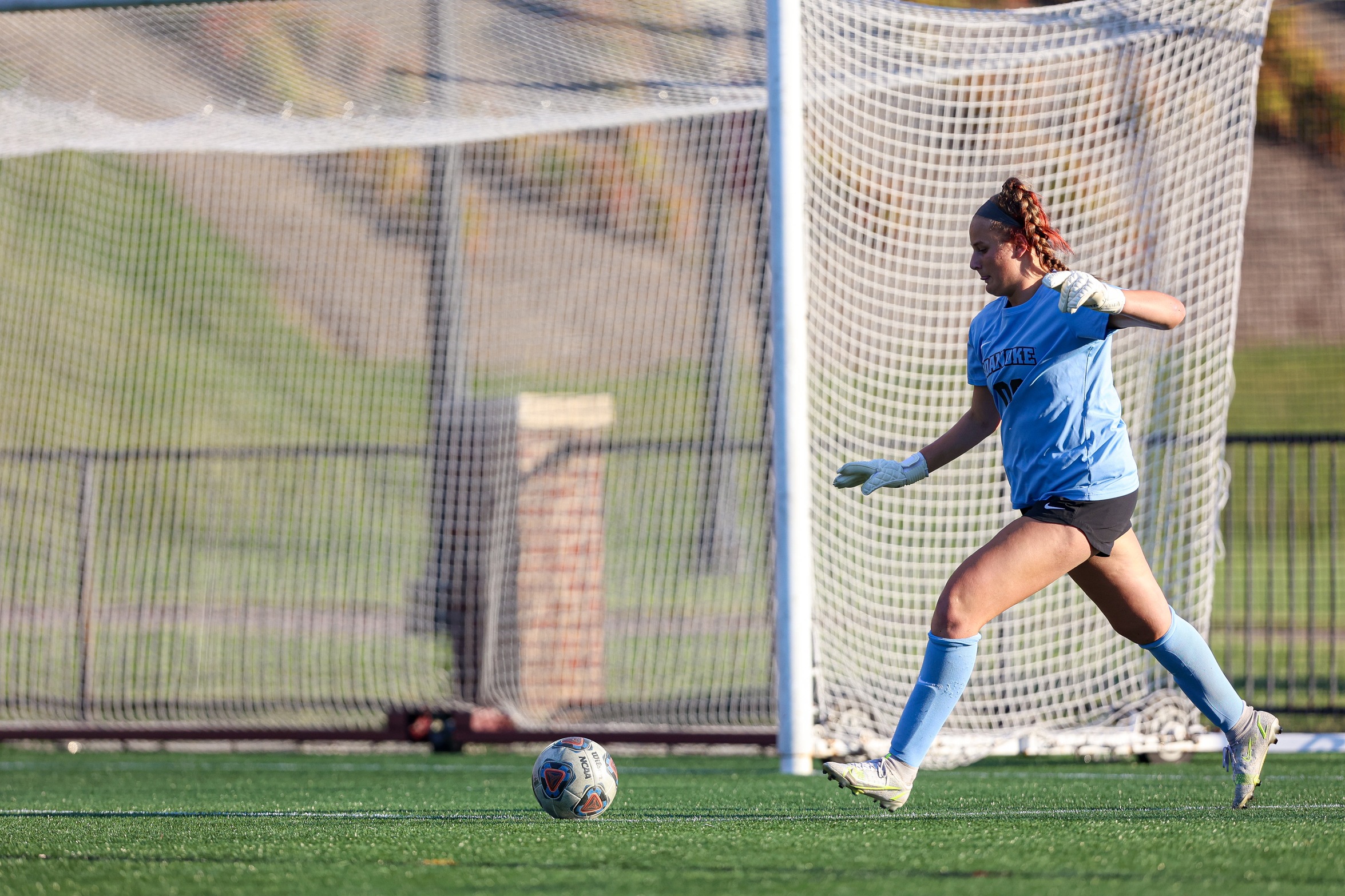 action photo of RC women's soccer goalkeeper Victoria Correll with a goal kick