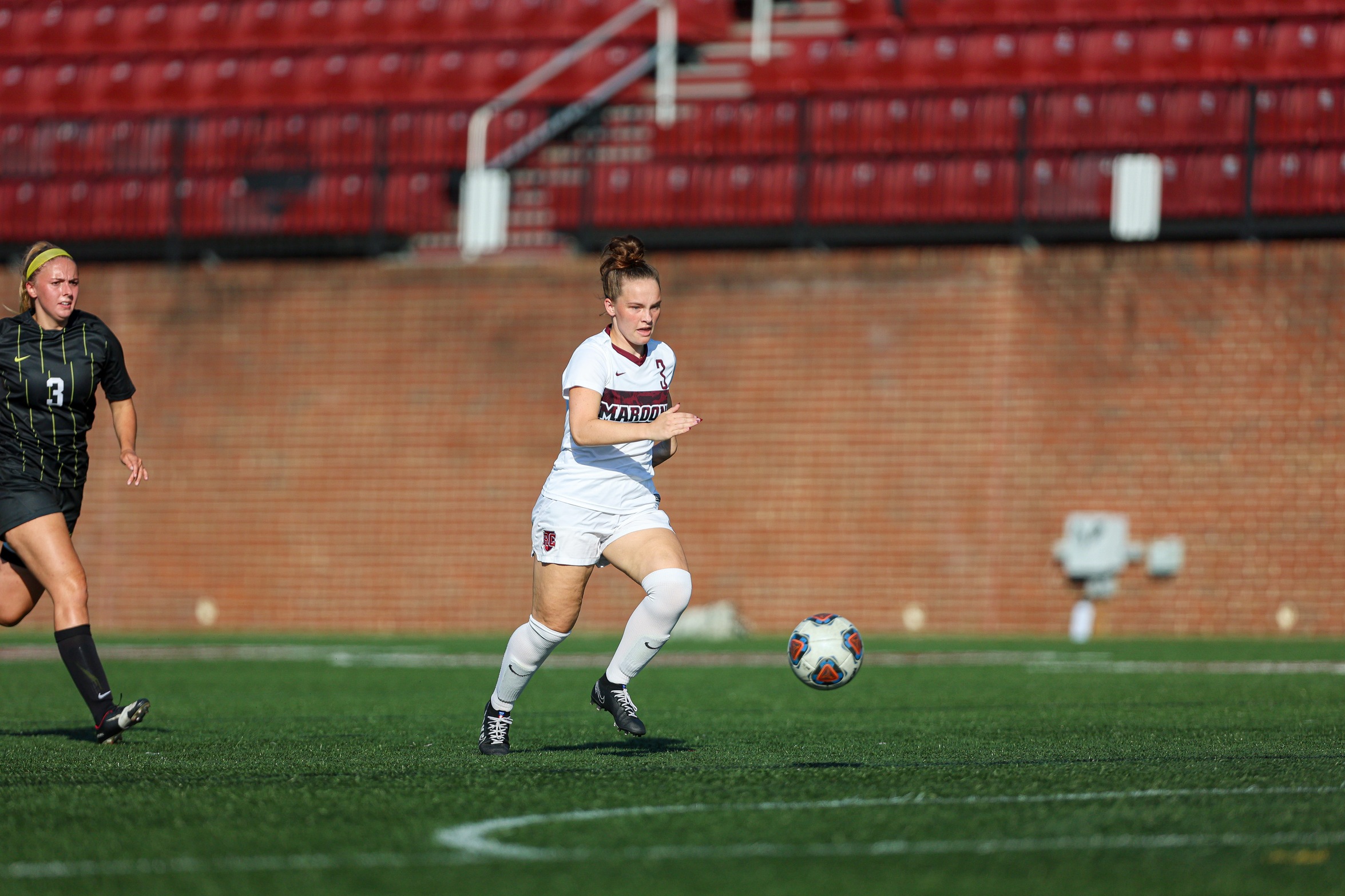 action photo of RC women's soccer player Lily Pawliczak