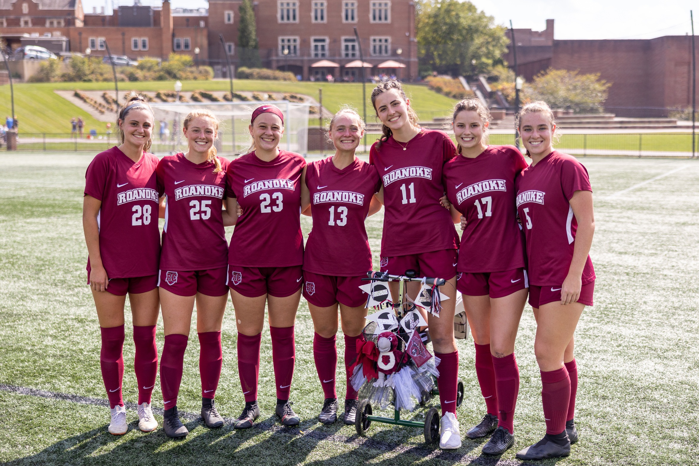 seven RC women's soccer seniors posing on Senior Day