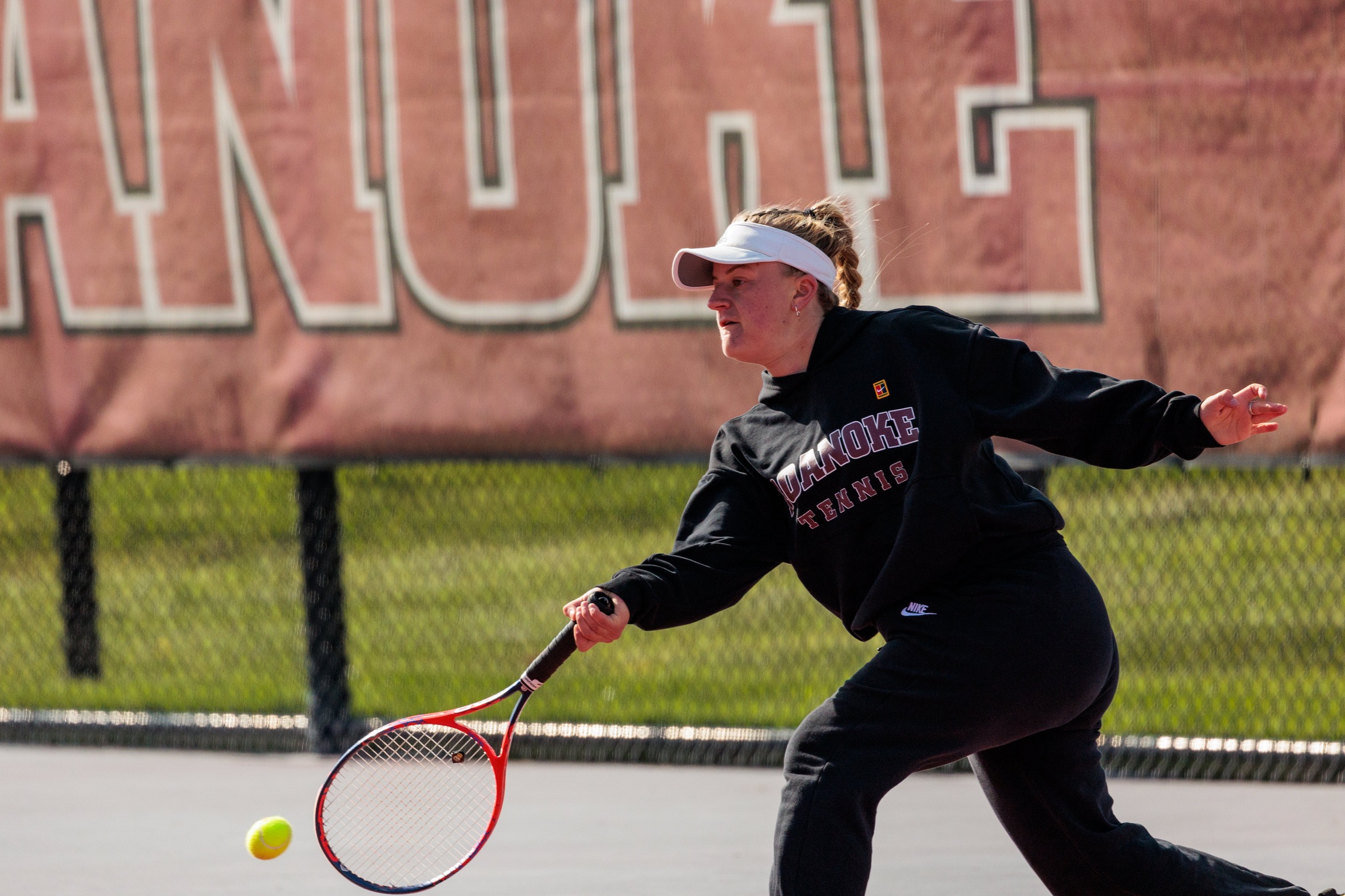 action photo of RC women's tennis player